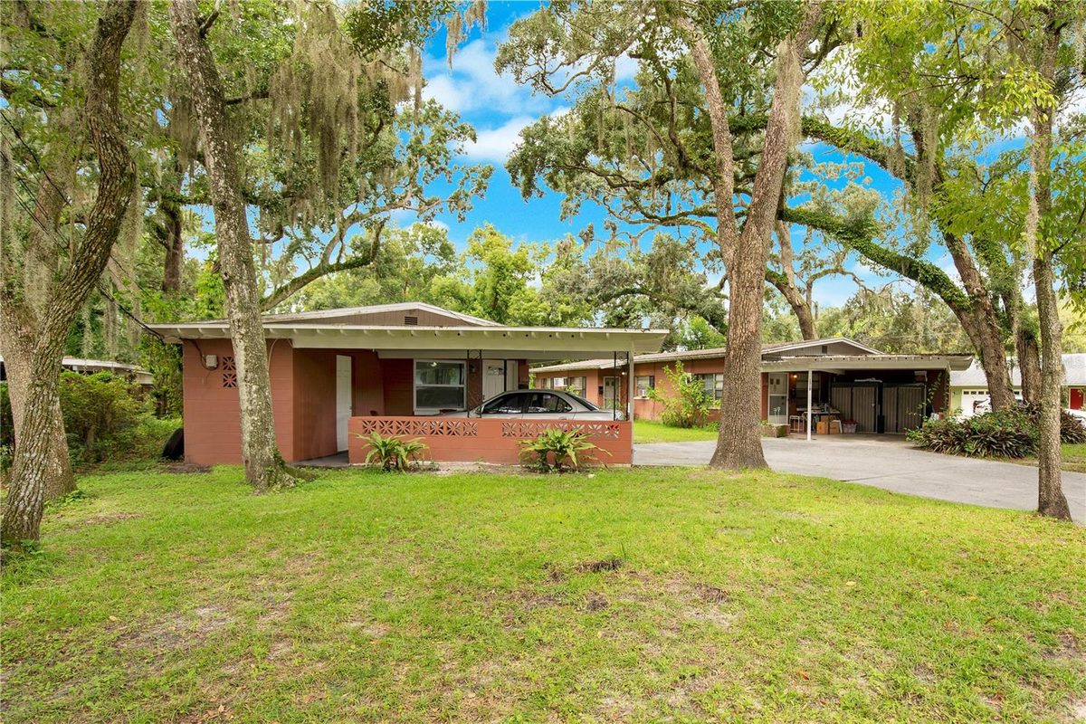 1304 Altaloma Ave, a four-unit property under mature oaks in Orlando's Mills50 District